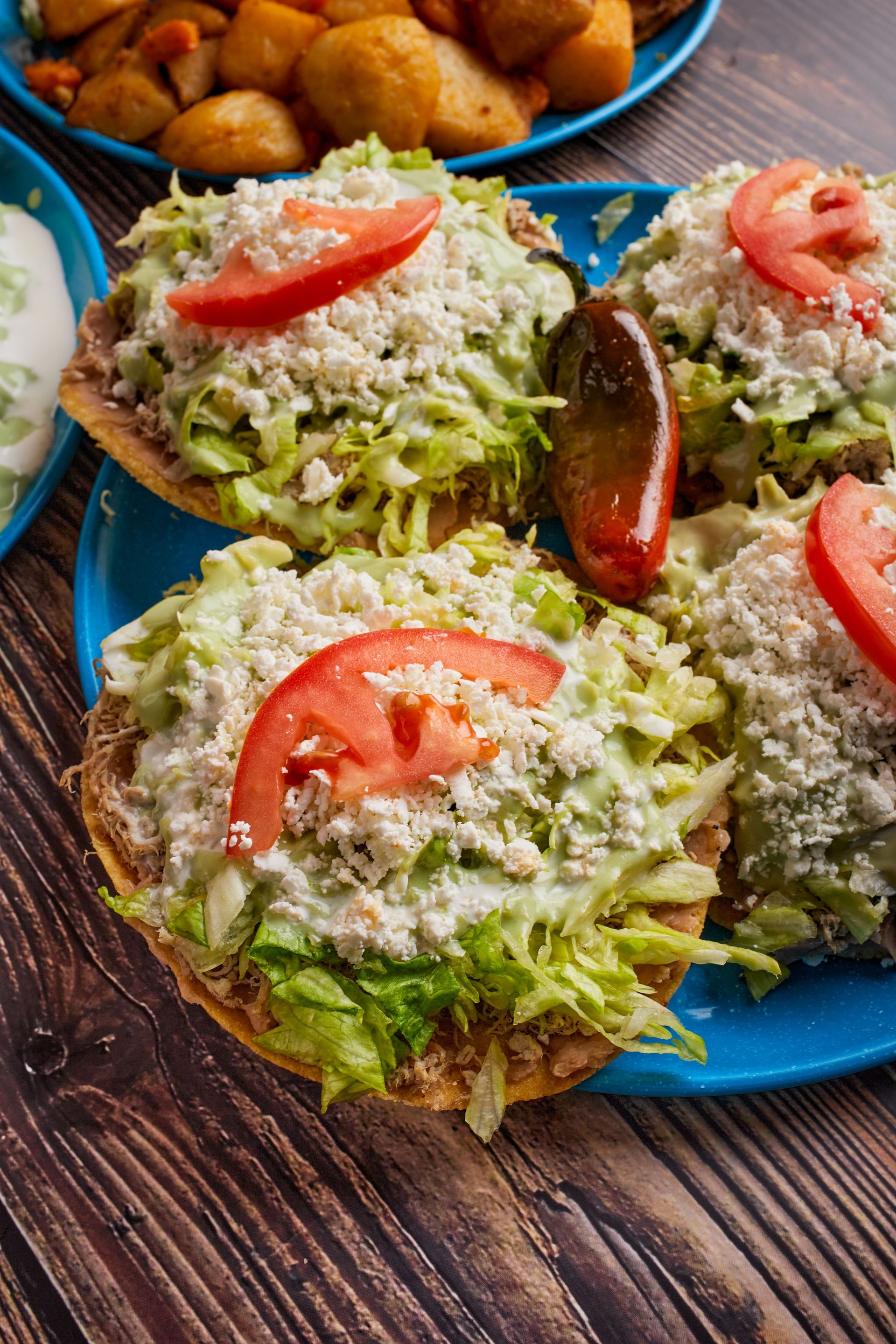 Delicious authentic Mexican tostadas topped with fresh vegetables and cheese, perfect for a healthy meal.